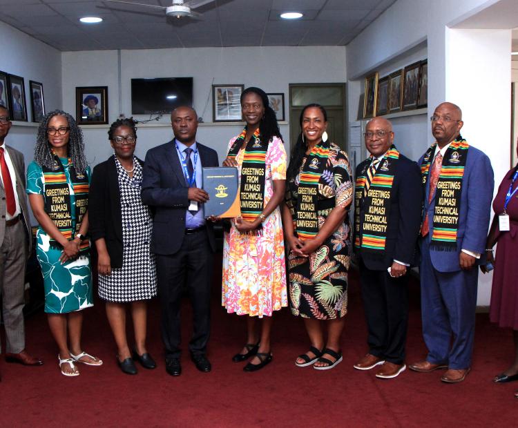 The Vice-Chancellor of Kumasi Technical University, Prof. Gabriel Dwomoh (second from left), together with the University Registrar (first from left), officially signs the Memorandum of Understanding (MoU) on behalf of KsTU during a formal engagement with the delegation from Johnson C. Smith University